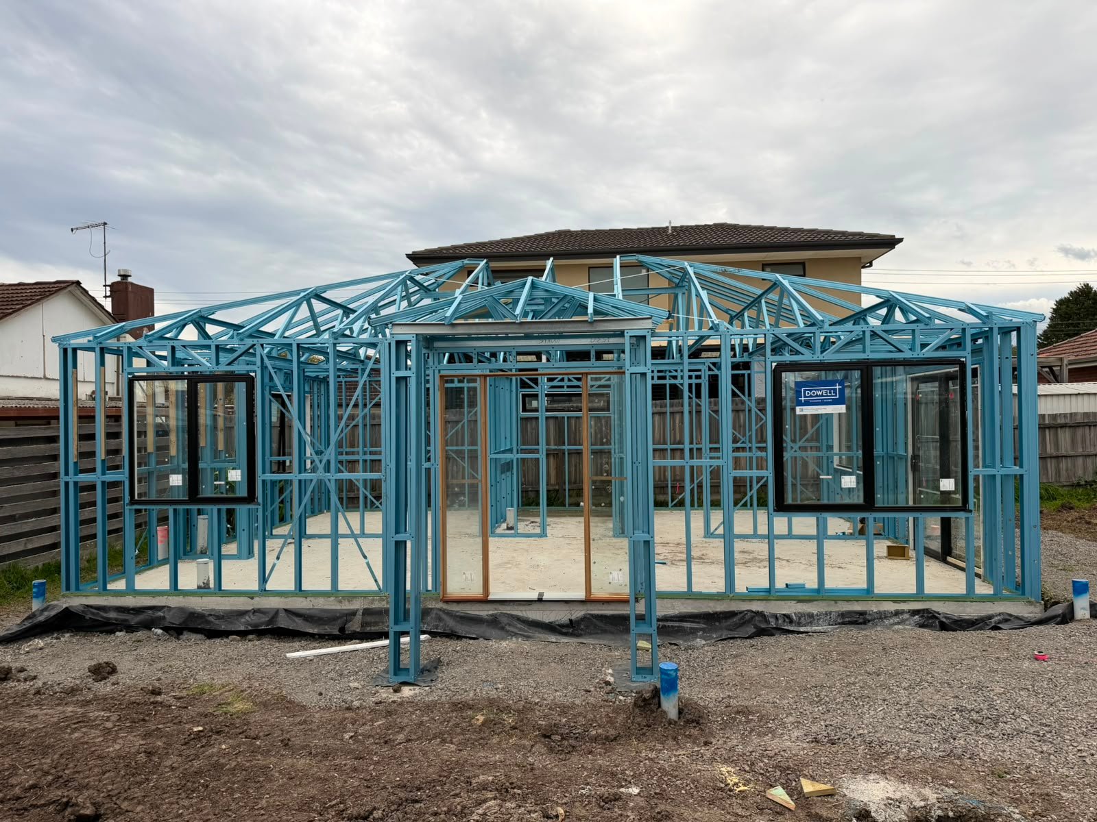 Steel wall frames and hip roof trusses installed on a single-storey home in Melbourne